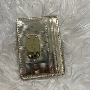 Micheal Kors Gold card holder.